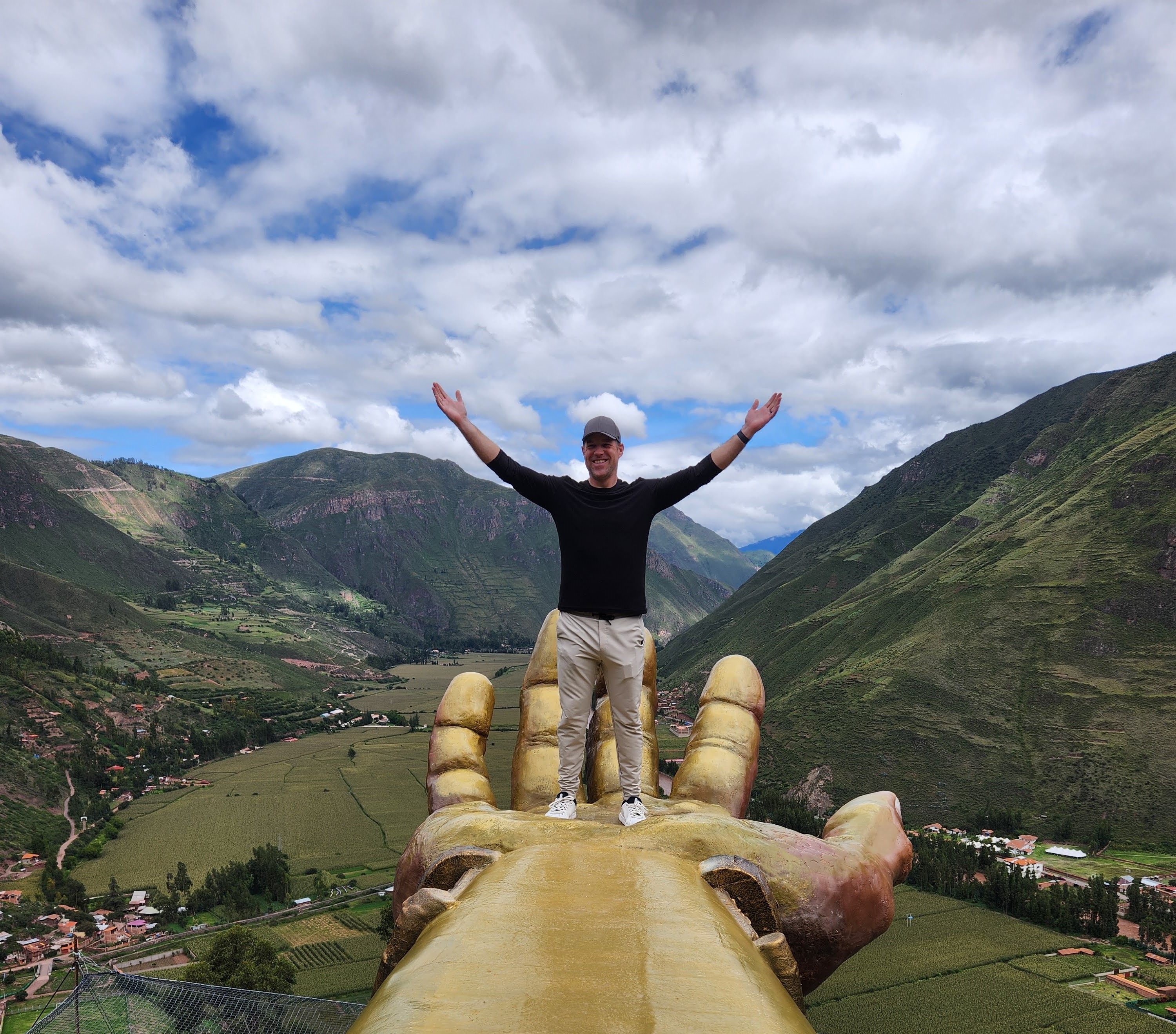 Chris Carey celebrating achievement in scenic landscape